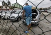 man-inspects-used-car-sale-vehicle-dealership-cubas-capital-havana